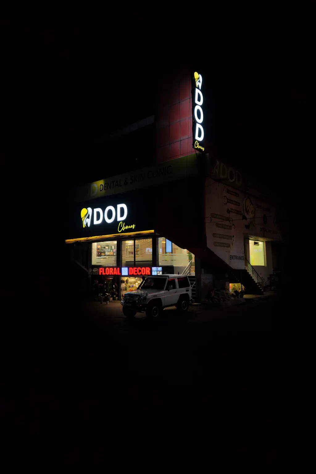 DOD Clinic exterior on Main PWD Road at night